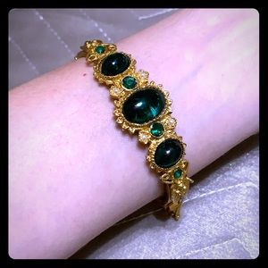 Vintage gold tone cuff with emerald green details